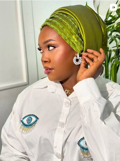 Black embellished turban with gold jewelry