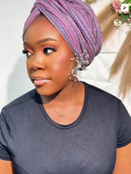 Pink and purple wrapped turban with jeweled accessory